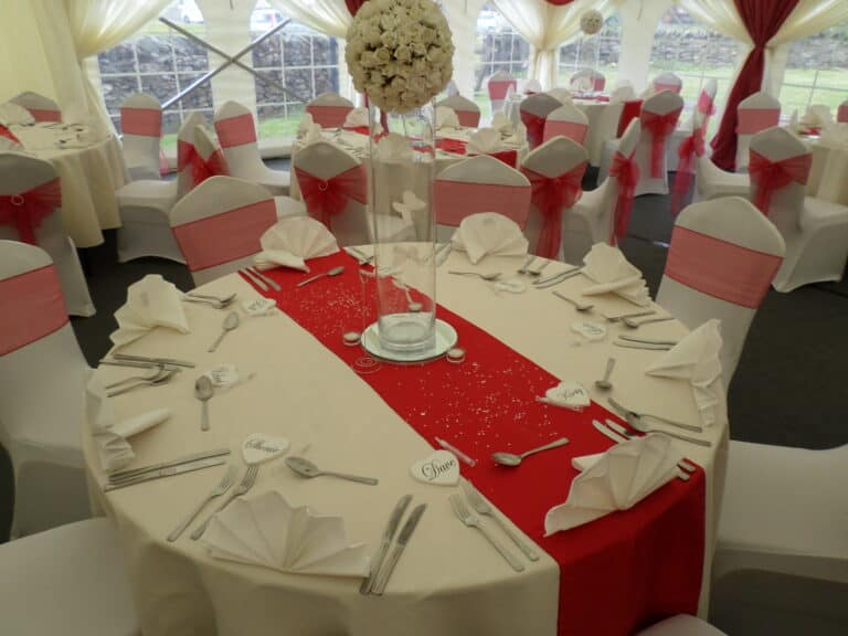 Wedding reception marquee with decorated tables and chairs in Leicester.